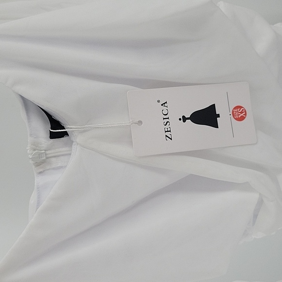 Elegant White Dress With Semi Transparent Sleeves - Picture 13 of 16